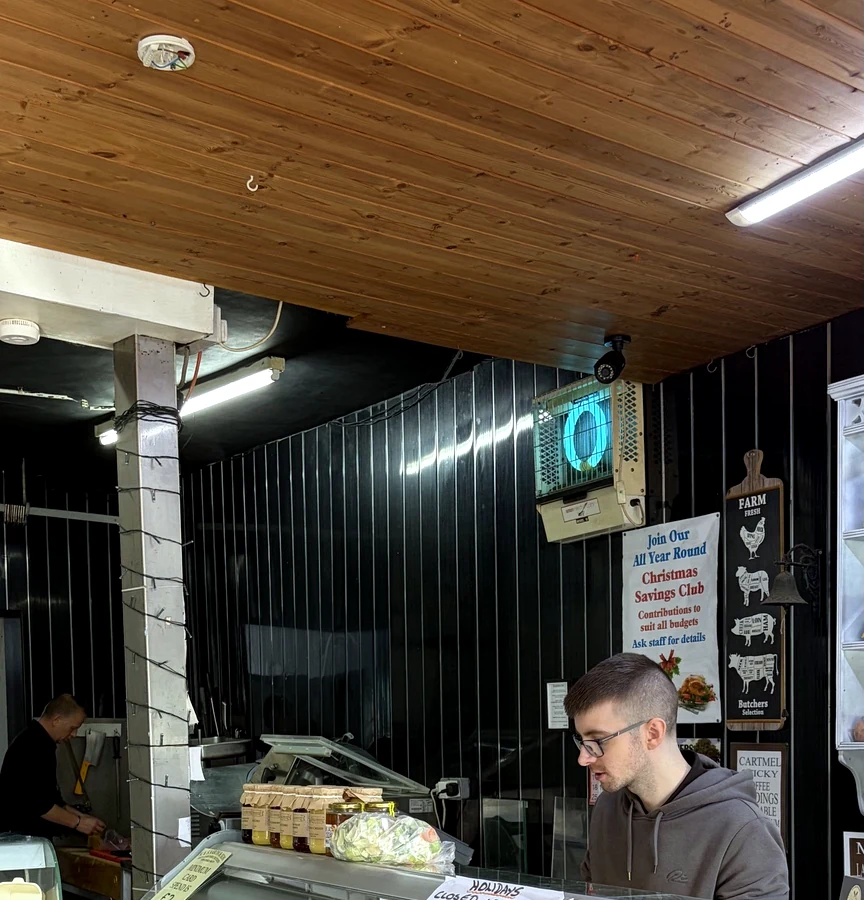 Jake behind the butcher's counter