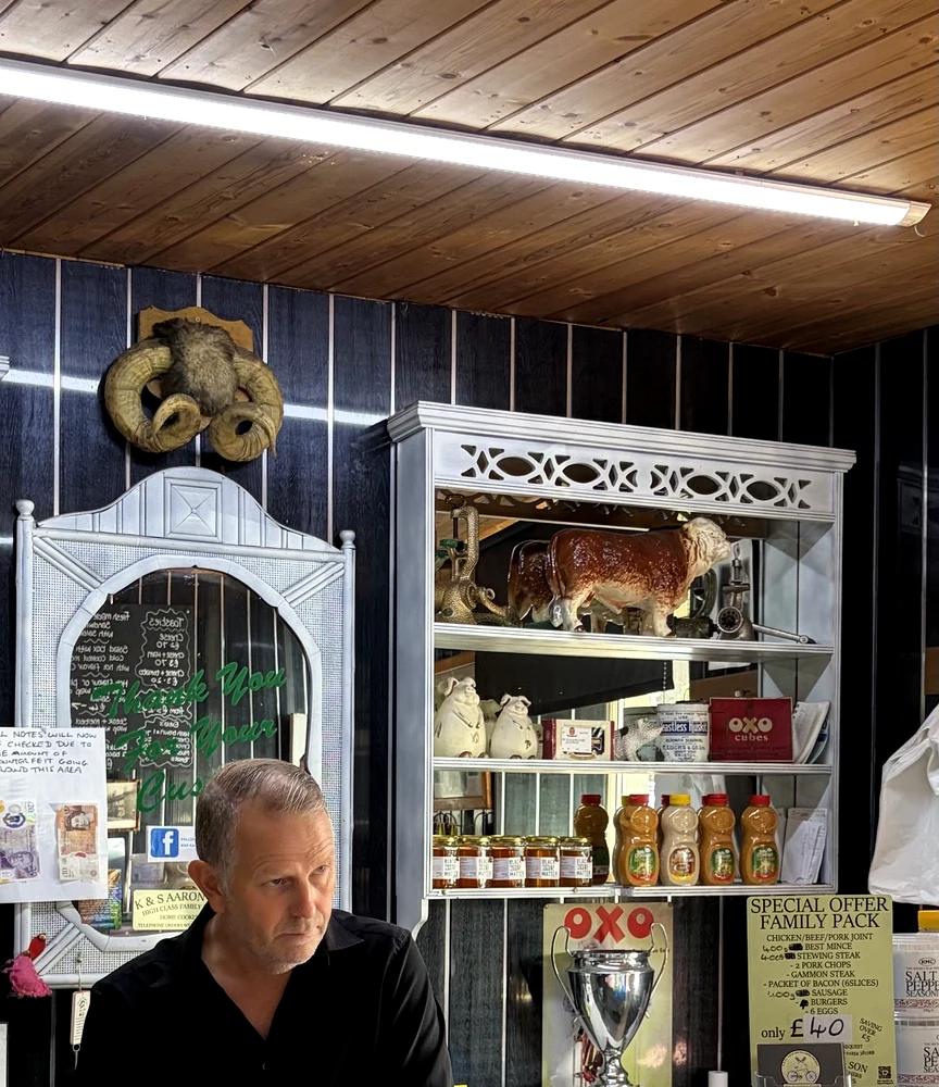 Kevin behind the butcher's counter