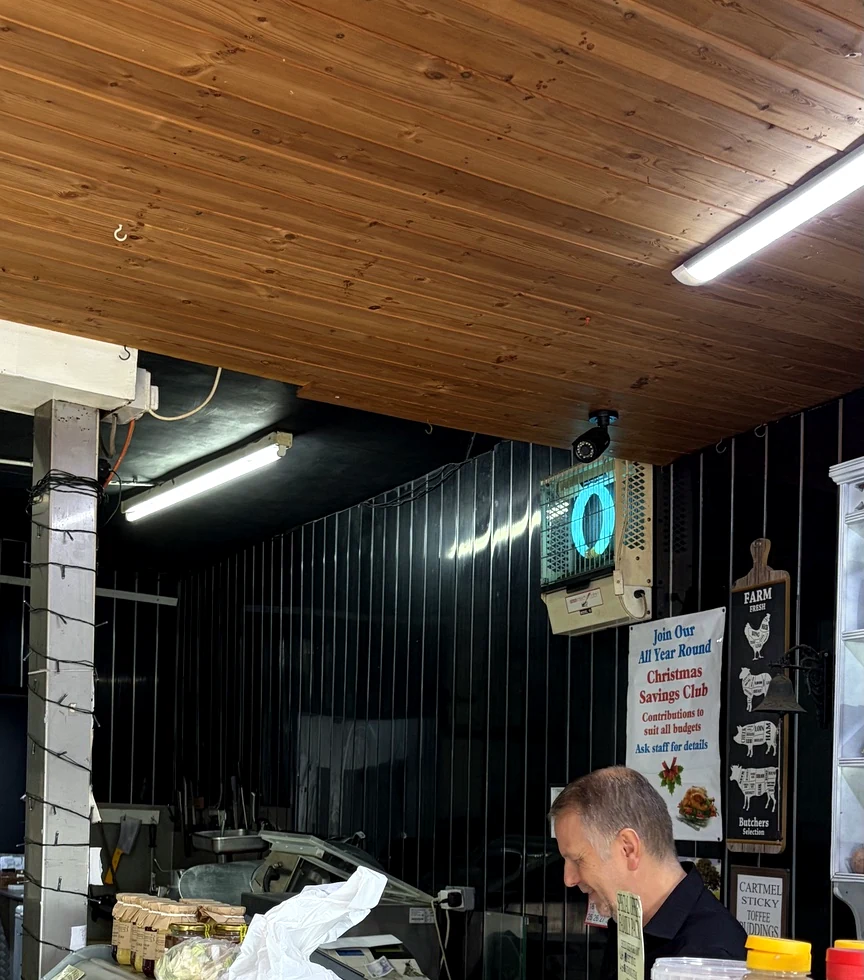 Kevin working behind the butcher's counter